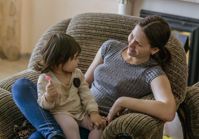 Women and child in chair